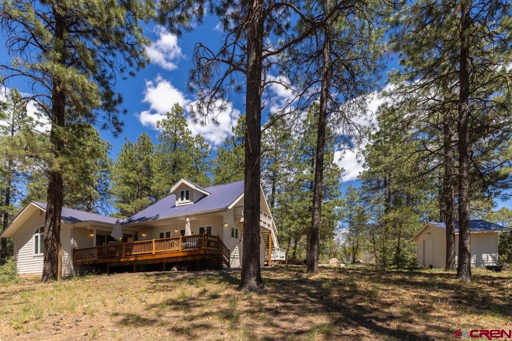 171 Deer Trail Road Durango, CO 81303 - Photo 2 of 35 a front view of a house with a yard