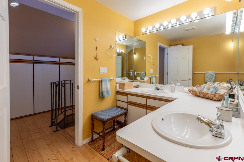 171 Deer Trail Road Durango, CO 81303 - Photo 24 of 35 a bathroom with 2 sink and a mirror