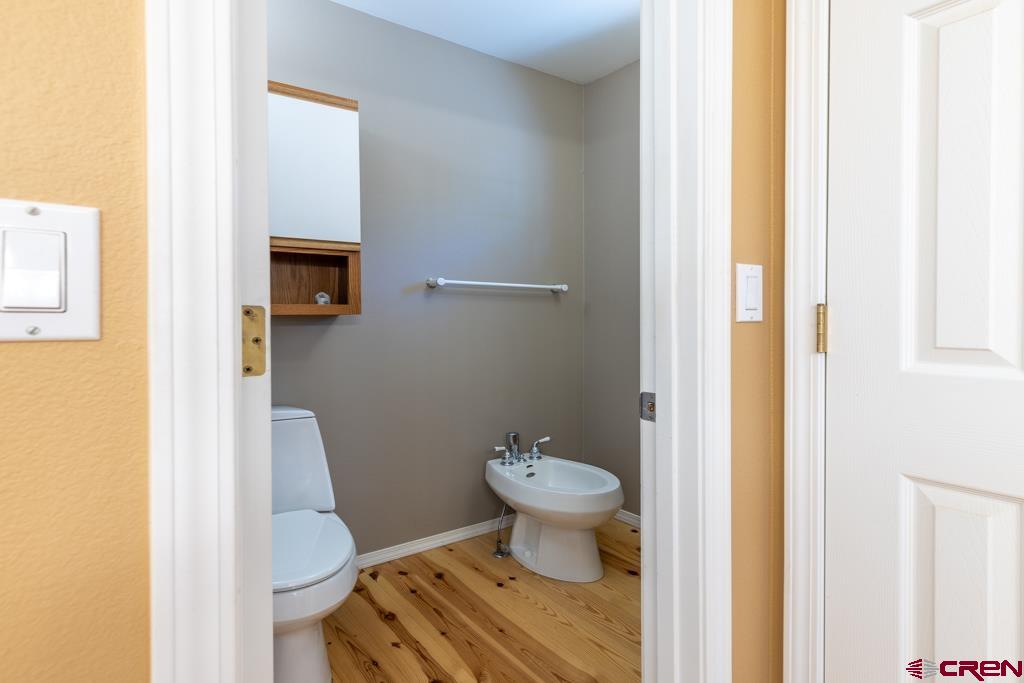 171 Deer Trail Road Durango, CO 81303 - Photo 28 of 35 a bathroom with a toilet and a sink
