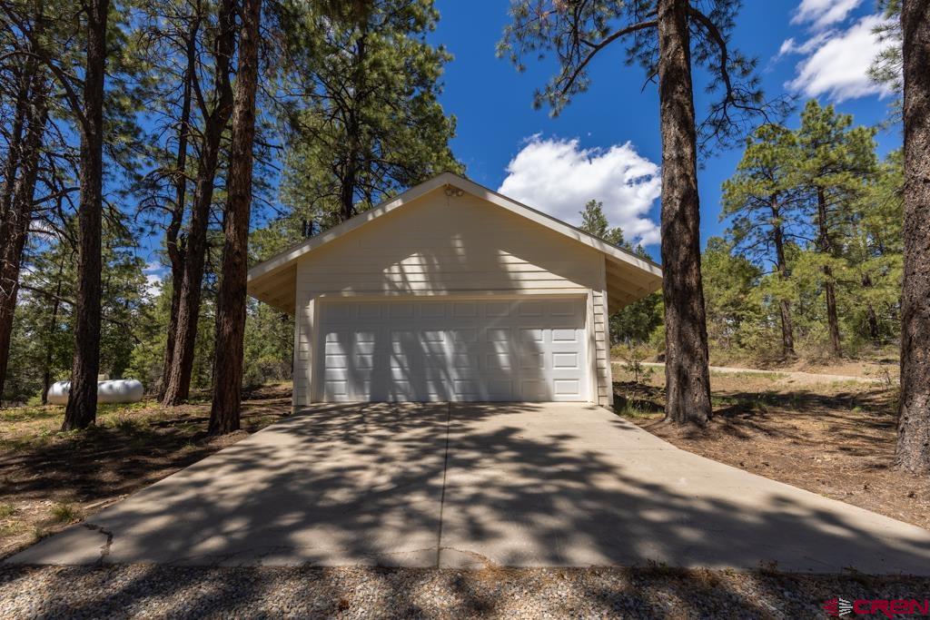 171 Deer Trail Road Durango, CO 81303 - Photo 29 of 35 a view of a house with a yard