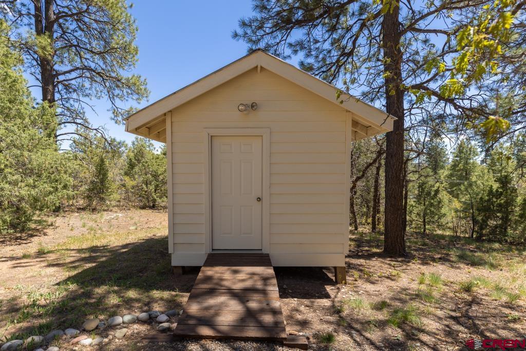171 Deer Trail Road Durango, CO 81303 - Photo 34 of 35 a front view of a house with a yard