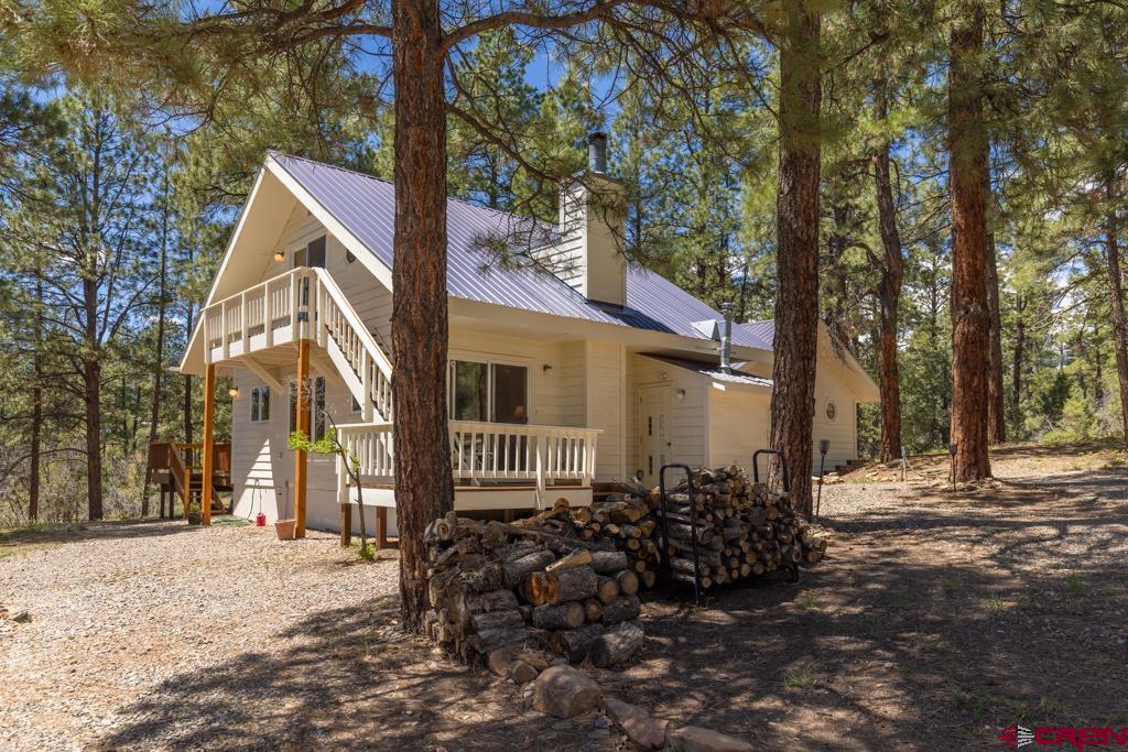 171 Deer Trail Road Durango, CO 81303 - Photo 4 of 35 a backyard of a house with lots of green space