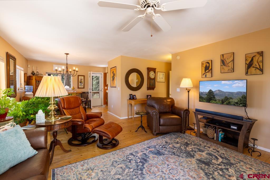 171 Deer Trail Road Durango, CO 81303 - Photo 8 of 35 a living room with furniture and a flat screen tv