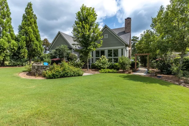 a view of staircase with wooden floor and a potted plant