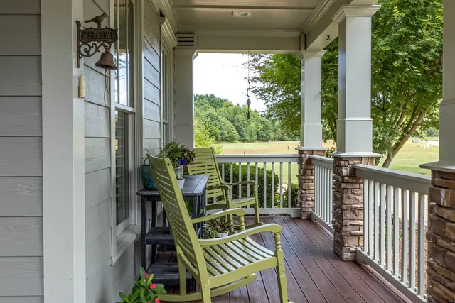 a view of a porch with wooden floor
