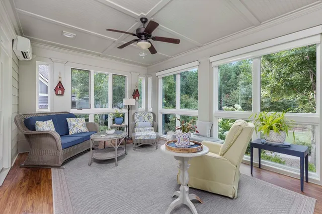 a view of a dining room with furniture window and wooden floor