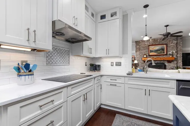 a bedroom with a bed dresser and a window