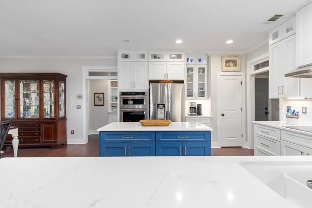 a view of a hallway with a window and stairs