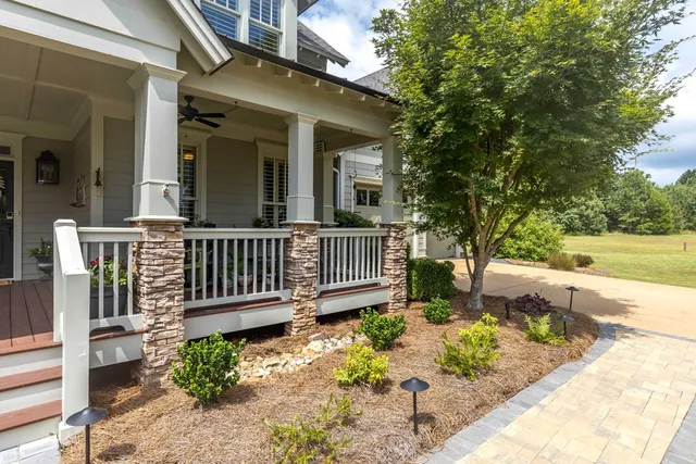 a front view of a house with garden