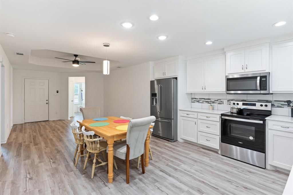 810 South Main Street Kemp, TX 75143 - Photo 4 of 16 a view of a dining room with furniture and wooden floor
