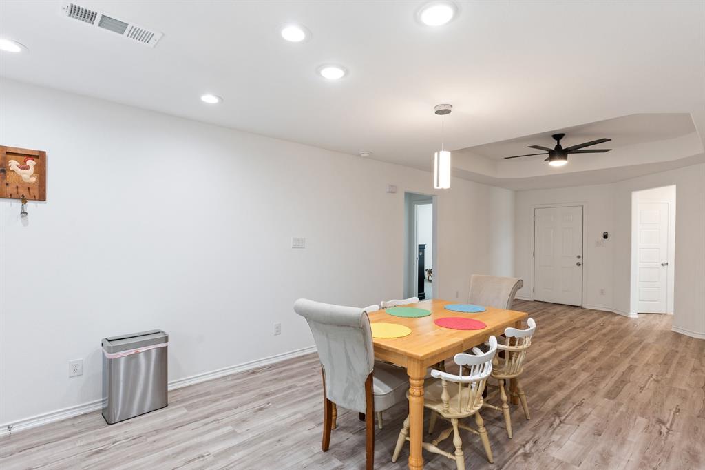 810 South Main Street Kemp, TX 75143 - Photo 5 of 16 a view of a dining room with furniture and wooden floor