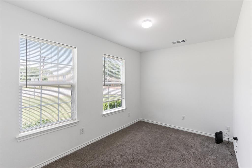 810 South Main Street Kemp, TX 75143 - Photo 7 of 16 an empty room with a window