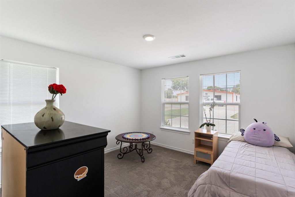 810 South Main Street Kemp, TX 75143 - Photo 8 of 16 a bedroom with furniture and a window