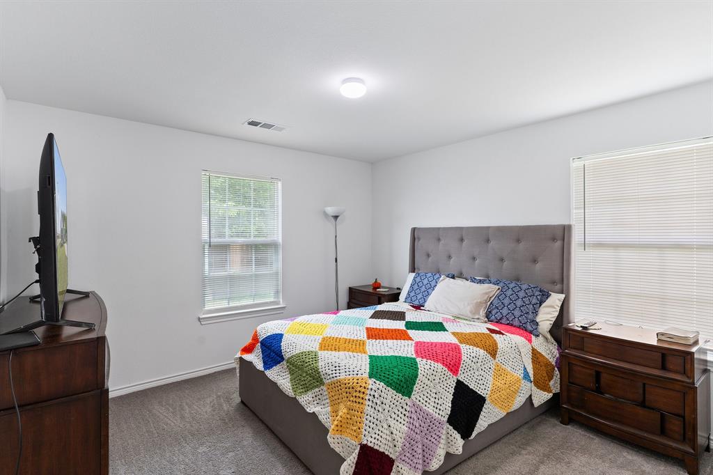 810 South Main Street Kemp, TX 75143 - Photo 10 of 16 a bedroom with a bed and window