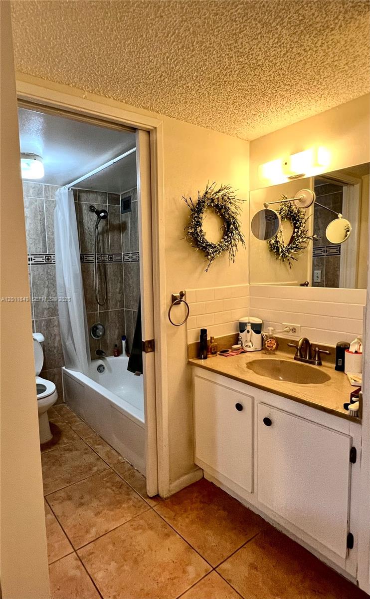 17011 North Bay Road, Unit 918 Sunny Isles Beach, FL 33160 - Photo 14 of 21 a bathroom with a sink mirror and vanity