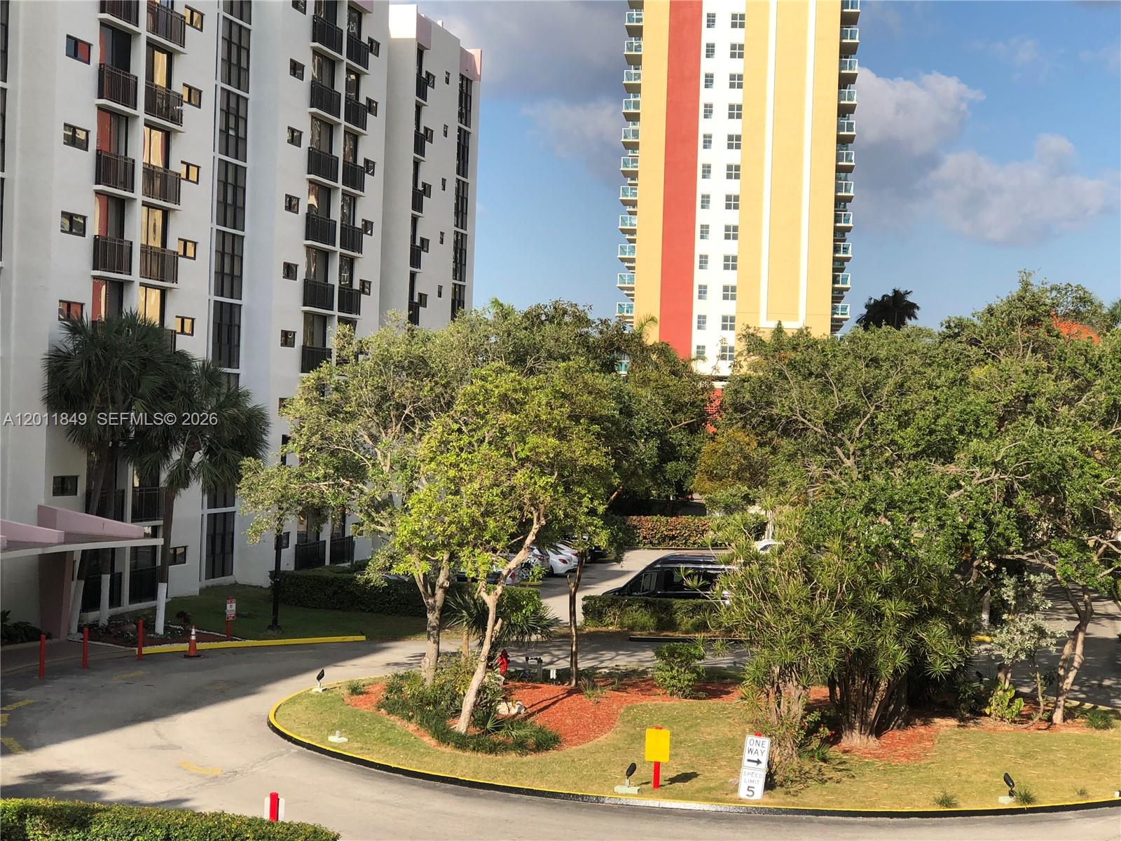 17011 North Bay Road, Unit 918 Sunny Isles Beach, FL 33160 - Photo 4 of 21 a view of a building with a yard