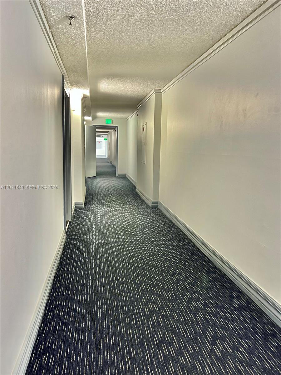 17011 North Bay Road, Unit 918 Sunny Isles Beach, FL 33160 - Photo 7 of 21 a view of a hallway with wooden floor