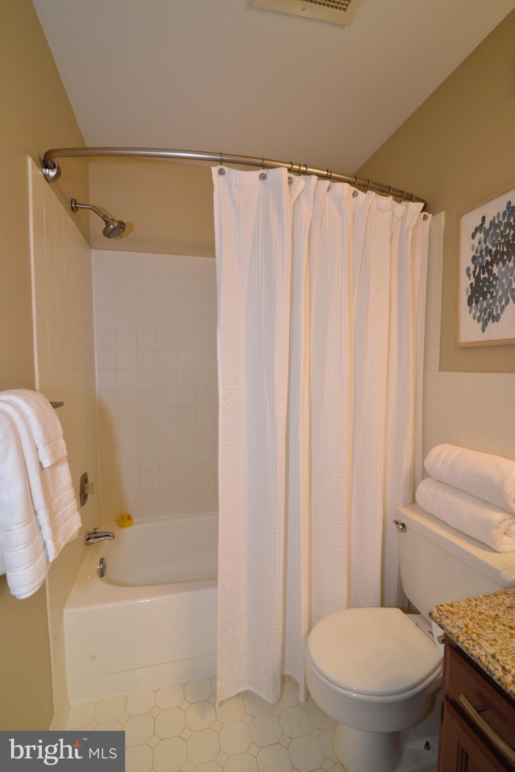 11128 Harbor Court Reston, VA 20191 - Photo 26 of 44 Full hall bath with a ceramic tile shower/tub.