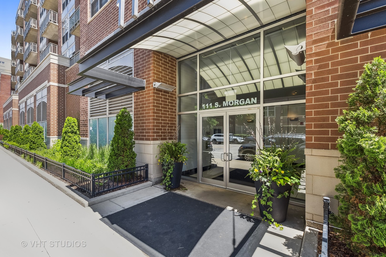 111 South Morgan Street, Unit 620 Chicago, IL 60607 - Photo 12 of 13 a house with potted plants in front of it
