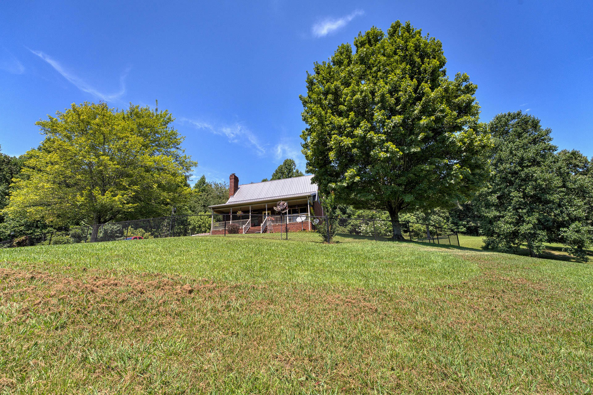 286 Oss Williams Road Limestone, TN 37681 - Photo 43 of 45 a house with trees in the background