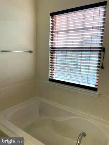 a view of a bathtub in a window