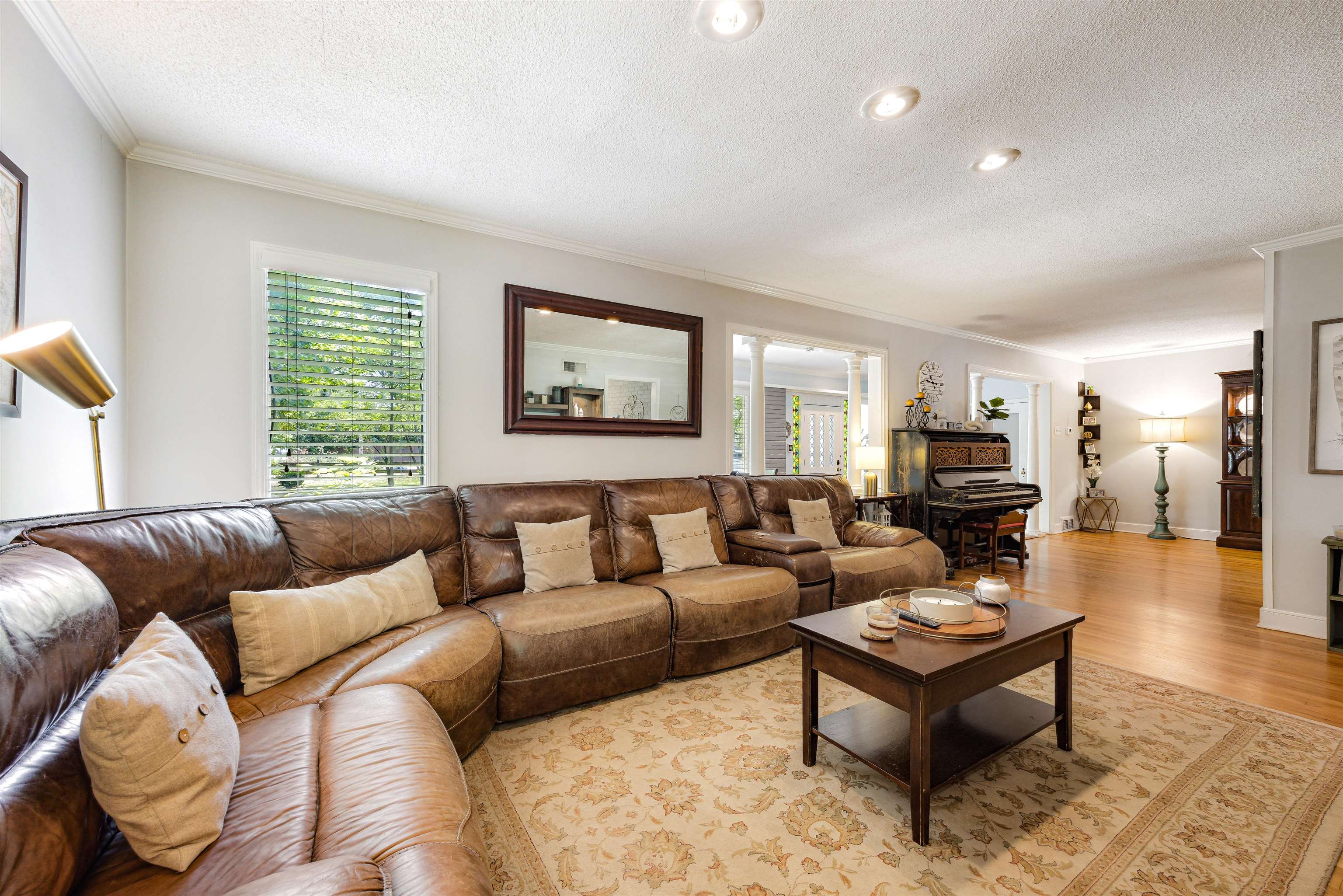 5068 Walnut Grove Road Memphis, TN 38117 - Photo 5 of 26 a living room with furniture a couch and a large window