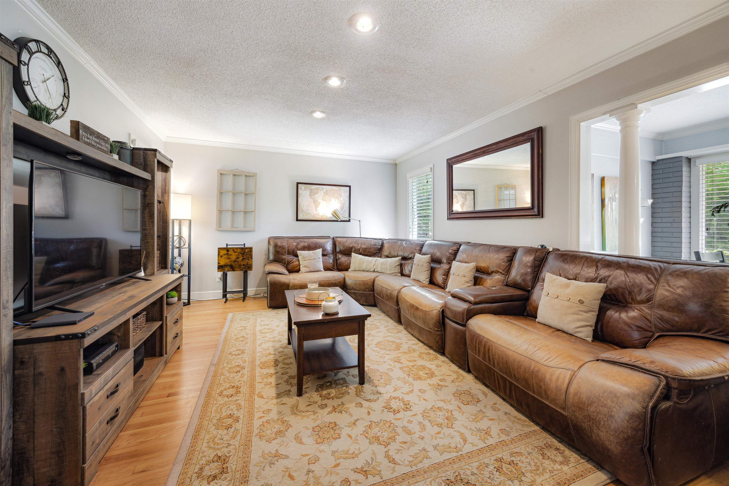 5068 Walnut Grove Road Memphis, TN 38117 - Photo 8 of 26 a living room with furniture and a flat screen tv