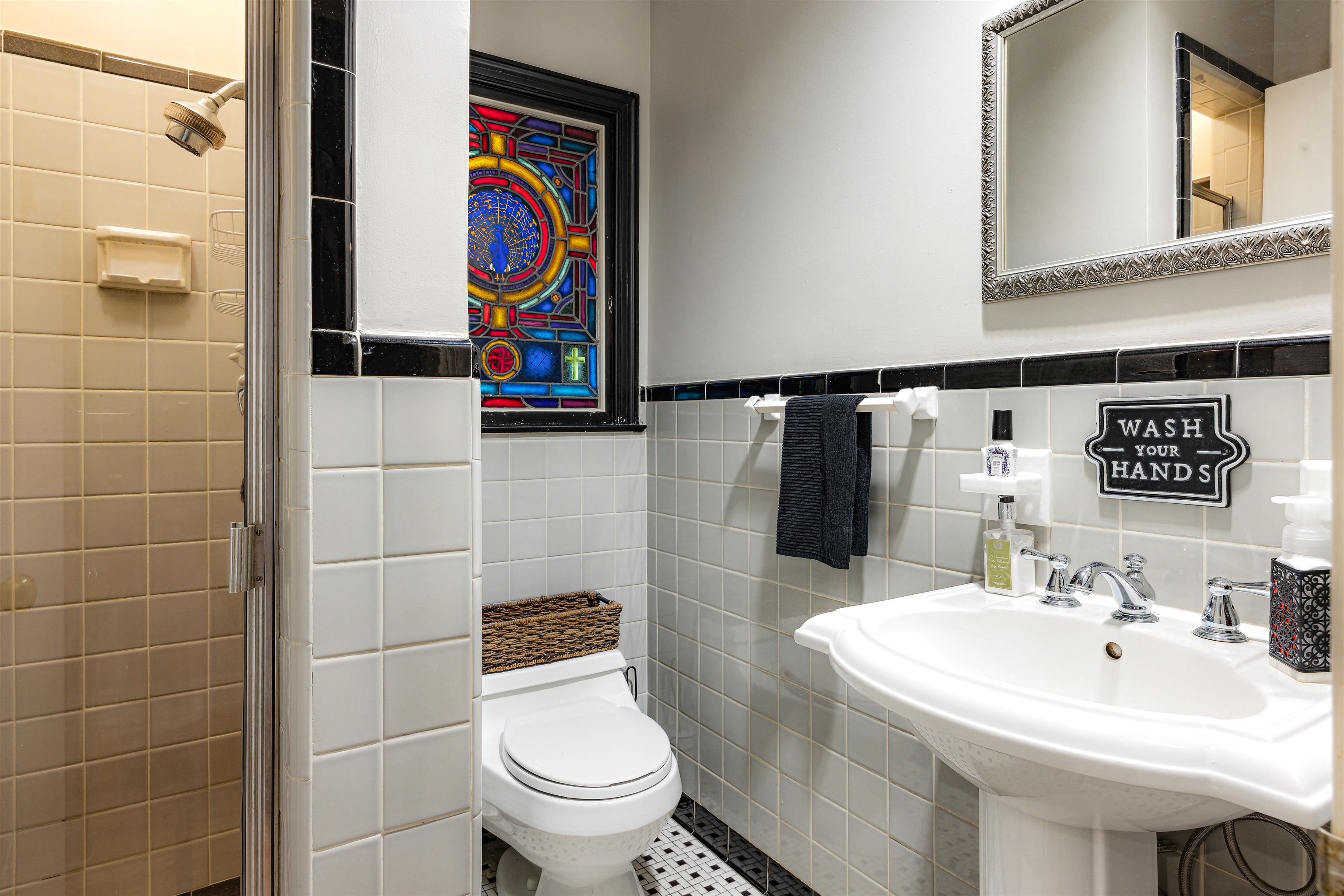 5068 Walnut Grove Road Memphis, TN 38117 - Photo 10 of 26 a bathroom with a toilet sink and mirror