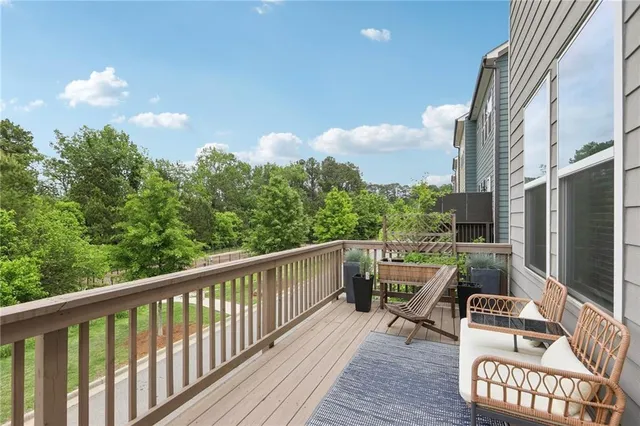 a view of balcony with furniture