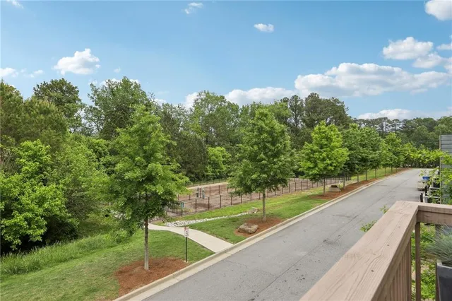 a view of a swimming pool with a yard