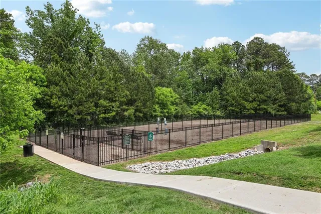 a view of a backyard with a garden and entertaining space