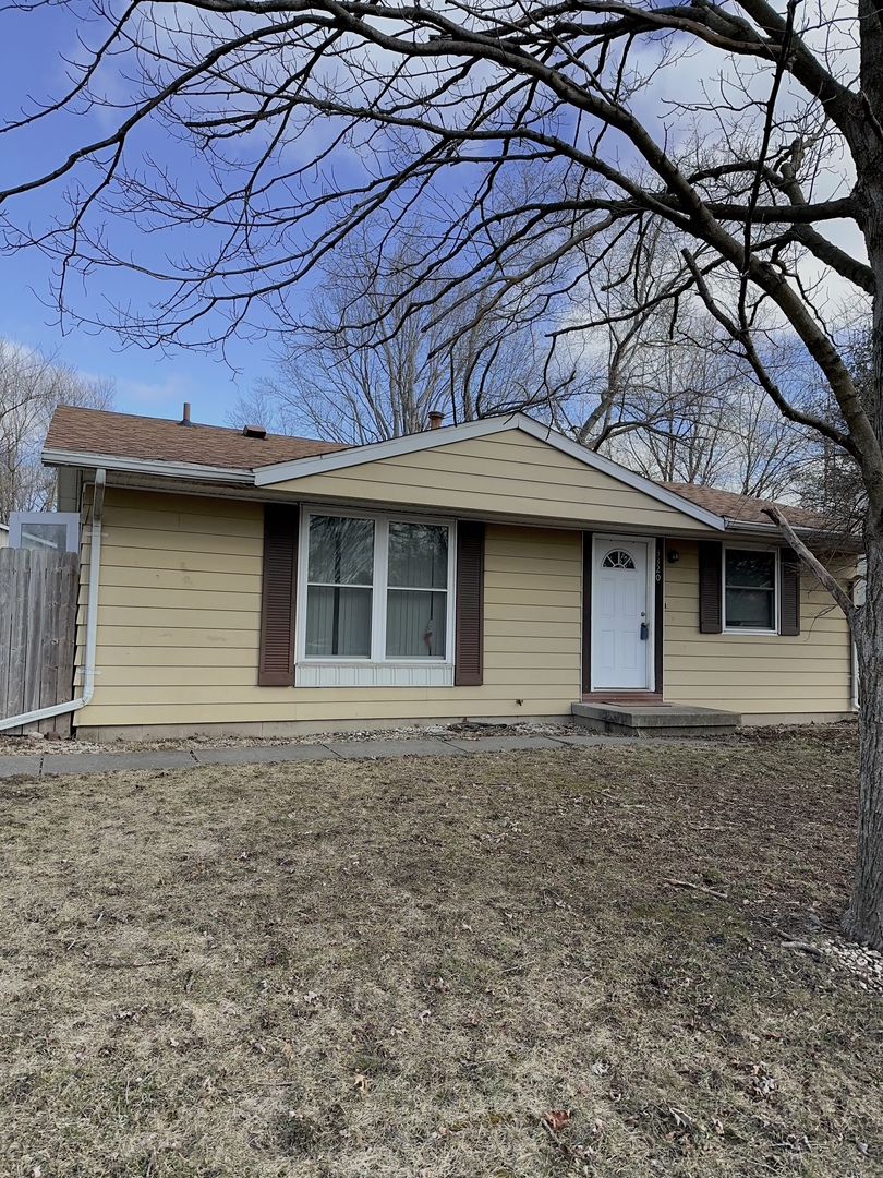 3320 York Drive Champaign, IL 61821 - Photo 2 of 4 a front view of a house with a yard