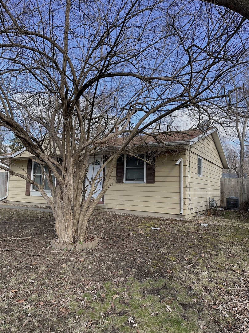 3320 York Drive Champaign, IL 61821 - Photo 3 of 4 a front view of a house with a yard