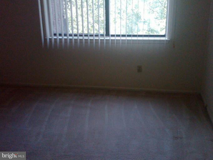 2901 Fallstaff Road, Unit 407 Baltimore, MD 21209 - Photo 5 of 9 an empty room with a window