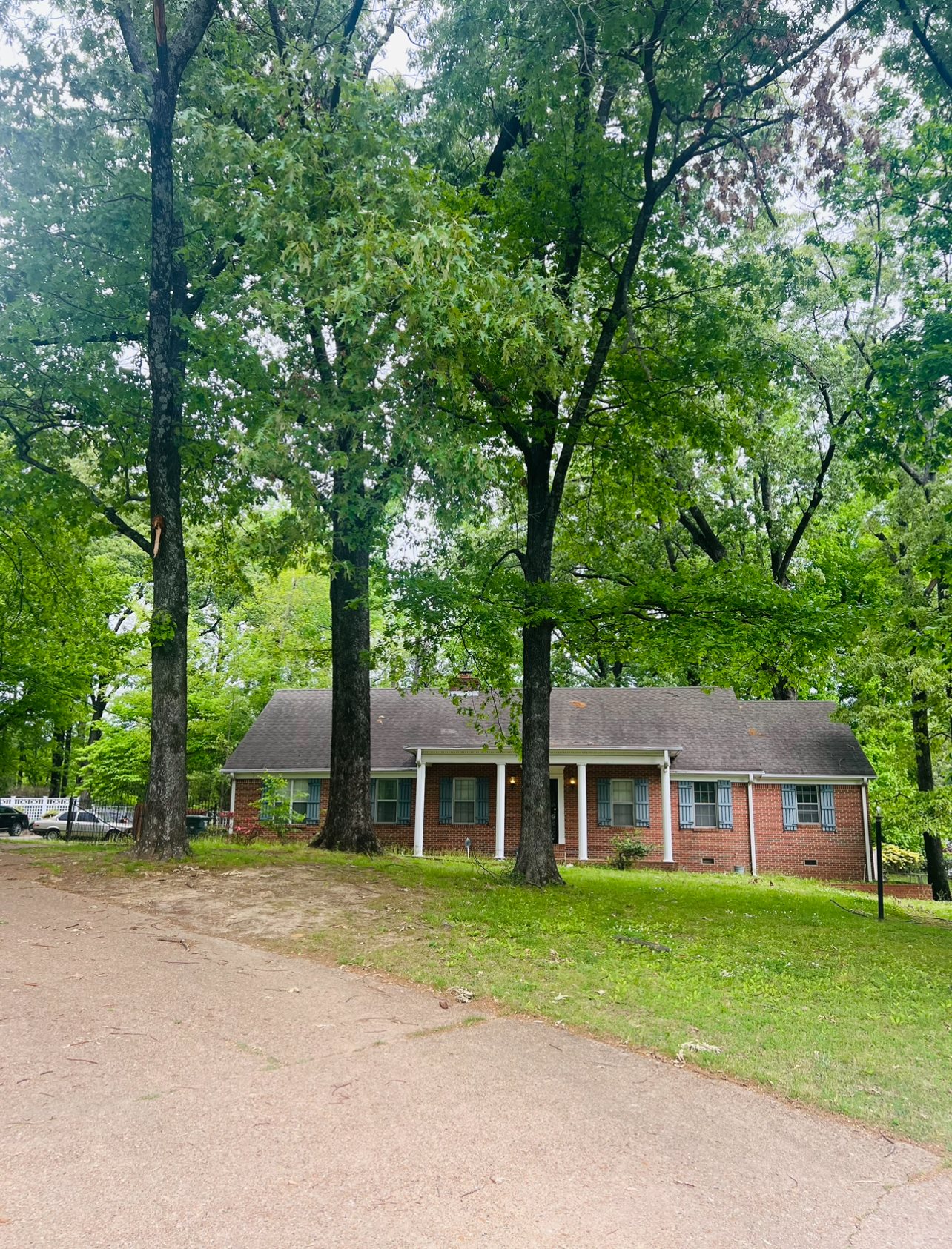 1040 Bluebird Road Memphis, TN 38116 - Photo 2 of 3 a front view of a house with a garden