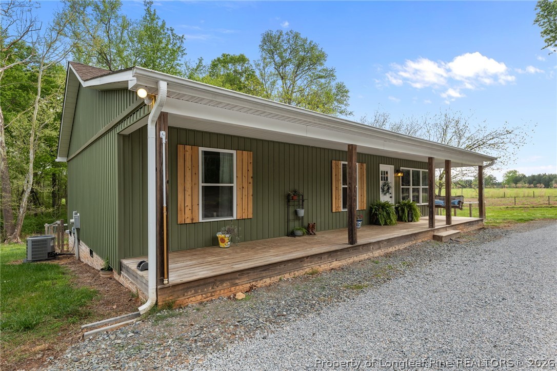 186 Lewis Brown Road Bennett, NC 27208 - Photo 3 of 48 a front view of a house with garden