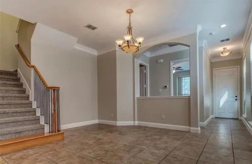 228 Wallington Way Lewisville, TX 75067 - Photo 16 of 22 a view of a chandelier in a room