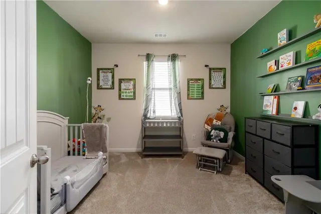 a bedroom with furniture and a window