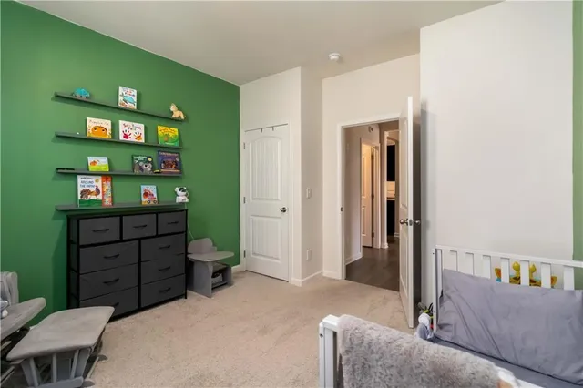 a bedroom with a bed and a bookshelf