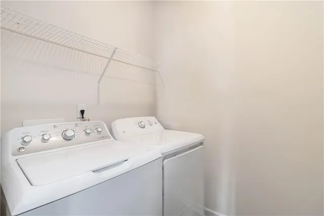a utility room with dryer and washer