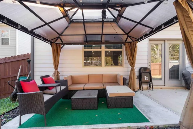 a outdoor living space with furniture and garden