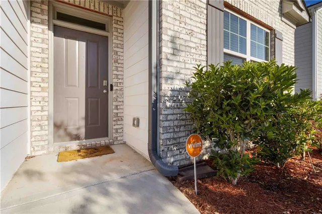 a backyard of a house with outdoor seating