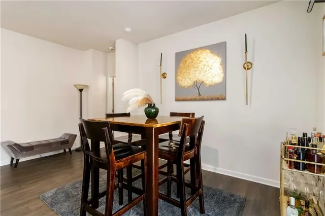 a view of a dining room with furniture and window
