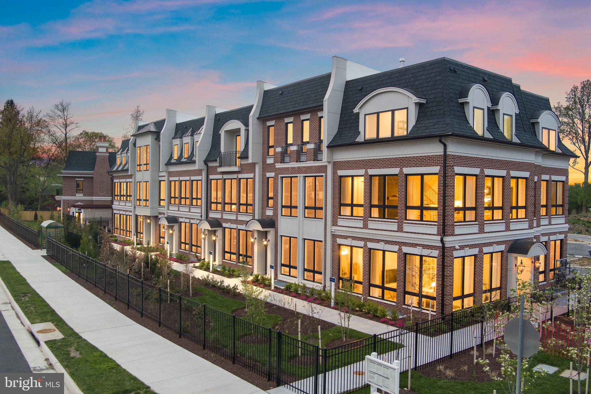 a view of a brick building next to a yard
