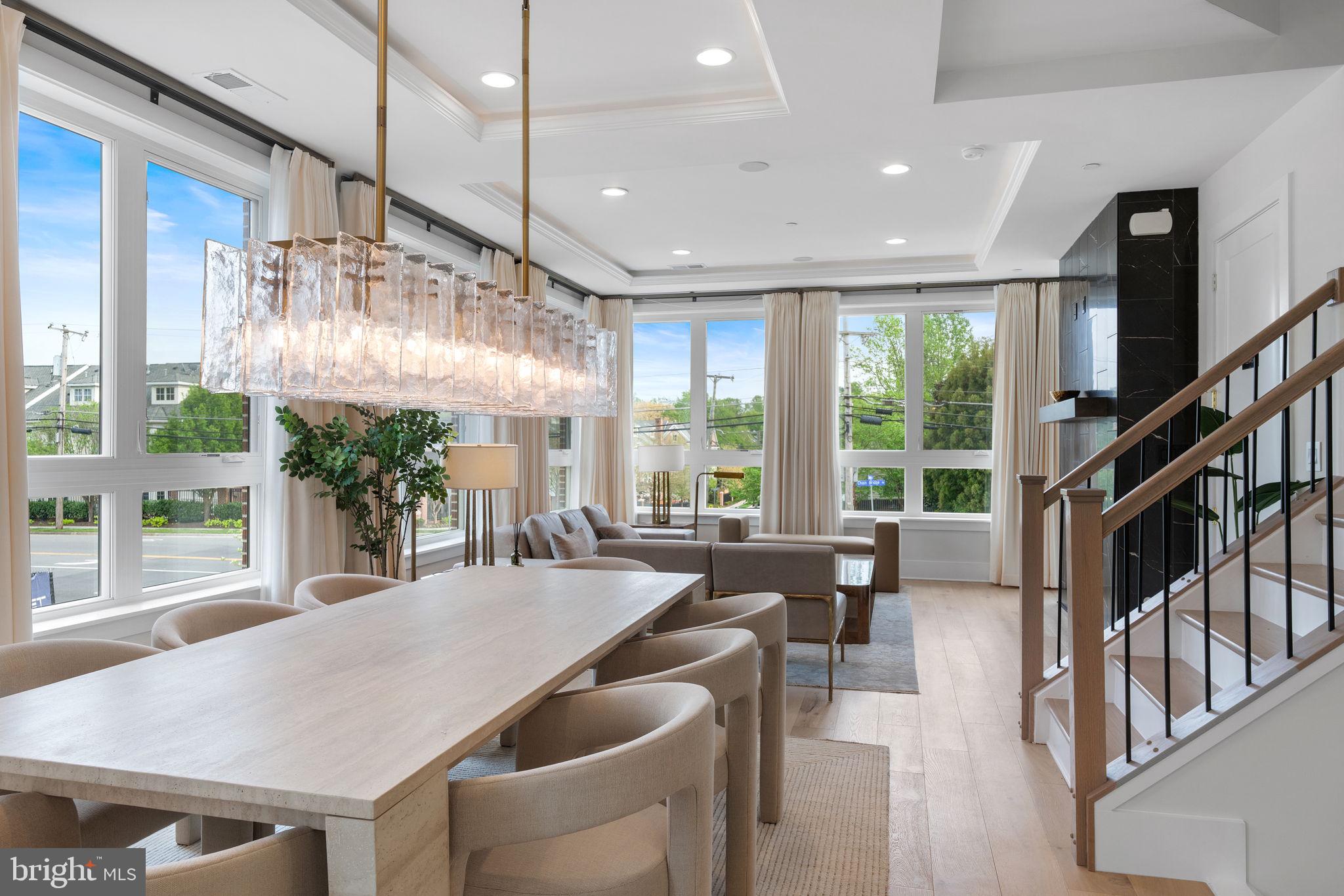 1624 Chain Bridge Road McLean, VA 22101 - Photo 3 of 10 a dinning area with furniture large windows and wooden floor