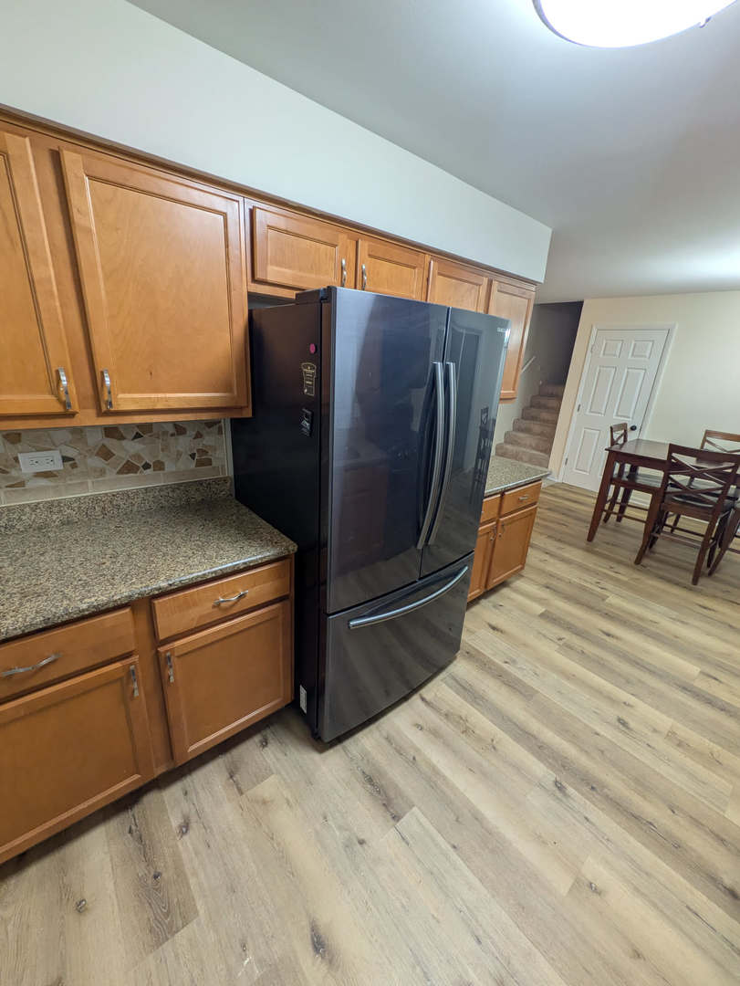 24031 South Cardinal Drive Channahon, IL 60410 - Photo 11 of 39 a room with wooden floor and furniture