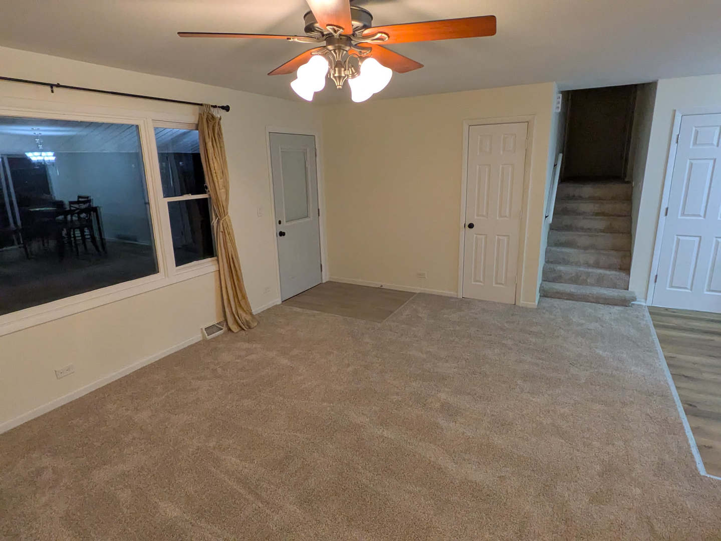 24031 South Cardinal Drive Channahon, IL 60410 - Photo 16 of 39 en empty room with wooden floor and chandelier fan