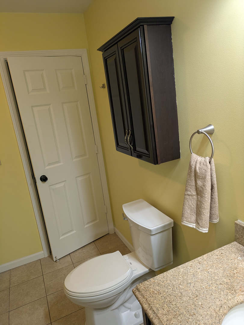 24031 South Cardinal Drive Channahon, IL 60410 - Photo 21 of 39 a white toilet sitting next to a bathroom sink and a mirror