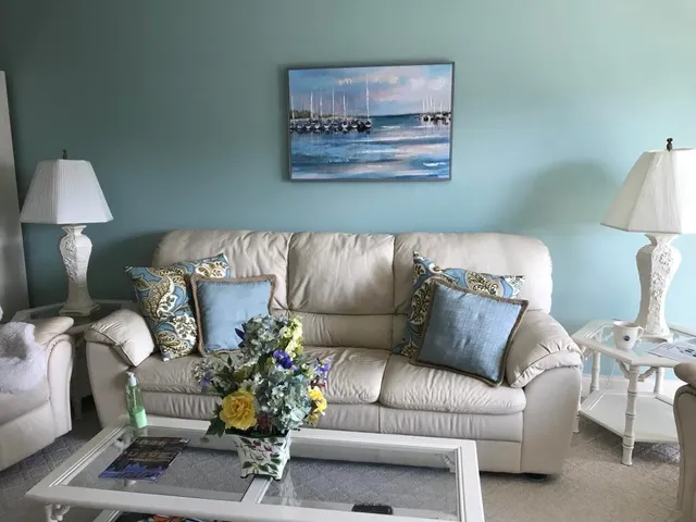 a bedroom with bed couch and window