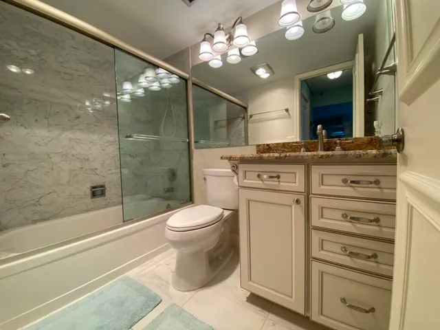 a bed room with a bed and a large mirror